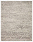 The Loloi Rayan Rug - Ash features a rectangular design in light beige and gray with a subtle geometric pattern of intersecting lines and a textured, hand-woven look.