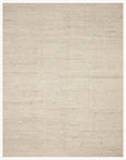 The Loloi Rayan Rug - Ivory is a square, light beige rug in neutral tones, featuring a subtle textured pattern and a simple, minimalist design.