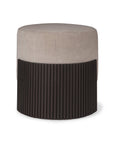 The Ethnicraft Roller Max Pouf features a light beige upholstered top and a dark, vertically ribbed lower half, combining modern minimalism with striking contrast—perfect for stylish contemporary spaces.