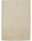 The Armadillo&Co Savannah Rug - Natural is a rectangular beige wool and cotton blend rug featuring a subtle, repeating chevron pattern for added texture.