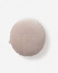 The CITTA Velvet Round Cushion - Scoria Tint features light beige velvet and a small fabric tag on the left, styled against a plain white background—a cozy New Zealand accent.