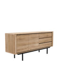 The Ethnicraft Shadow Sideboard with Legs - 71 features classic European style with three drawers, two cabinet doors, a natural wood finish, and black metal legs, shown here against a white background.