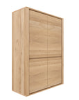 The Ethnicraft Shadow Storage Cupboard - Oak is a tall wooden unit, crafted from European oak with a natural finish, featuring two upper and two lower doors, and displayed against a plain white background.