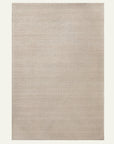 The Sherpa Weave Rug - Chai by Armadillo&Co is a rectangular, light beige handwoven wool rug featuring a subtle, uniform texture and shown on an off-white background.