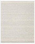 The Loloi Sloane Rug - Mist is a light gray, rectangular hand-woven area rug with subtle horizontal stripes and finished edges, shown against a white background.