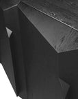 Close-up of the Ethnicraft Stairs Sideboard - 3 door, crafted from black-stained European oak. Its geometric, faceted surfaces and visible grain highlight classic refinement and contemporary design.