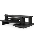 The Ethnicraft Teak Abstract Coffee Table is a modern black wood piece with an architectural, multi-level design featuring overlapping rectangular shelves and solid vertical supports, inspired by the de Stijl movement.