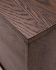 A close-up of the Yorke Sideboard by Wooden Stories highlights its smooth oak surface, distinct wood grain, and crisp edges—showcasing Scandinavian design and expert craftsmanship.