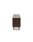 The Yorke Sideboard by Wooden Stories, made from dark wood, stands on four short legs and is shown from the side against a plain white background.
