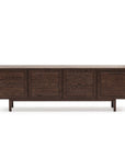 The Yorke Sideboard by Wooden Stories features four cabinet doors, clean lines, and simple legs in dark wood, highlighting classic Scandinavian design against a plain white background.