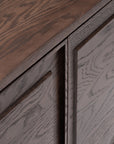 Close-up of the Wooden Stories Yorke Sideboard in solid oak, featuring its natural grain and smooth matte finish at the corner where the top surface meets the side and front panels.