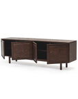 The Yorke Sideboard by Wooden Stories features solid oak construction, four open cabinet doors revealing shelves, and a modern Scandinavian design with short legs, shown here against a white background.