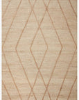 The Bodhi Rug by Loloi in Ivory/Natural Diamond is hand-knotted in India from 100% jute and showcases a simple Moroccan-inspired geometric pattern of overlapping brown diamond shapes for timeless style.