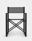 The Harbour Pacific Folding Chair - Black Teak is a modern black directors chair with a canvas seat and backrest, shown front view on a plain white background. This stylish outdoor piece features a classic folding X-frame design.