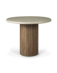 The Roller Max Outdoor Dining Table by Ethnicraft features a smooth, hand-finished light gray concrete tabletop with a round silhouette, supported by a vertical slatted reclaimed teak cylindrical base. The table is showcased against a white background.
