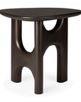 The Flow Side Table by Ethnicraft is a compact, dark solid mahogany piece featuring three sculpted legs and curved cutout accents. Its rounded triangular top and artistic, modern design reflect the refined elegance of vintage modern furniture.