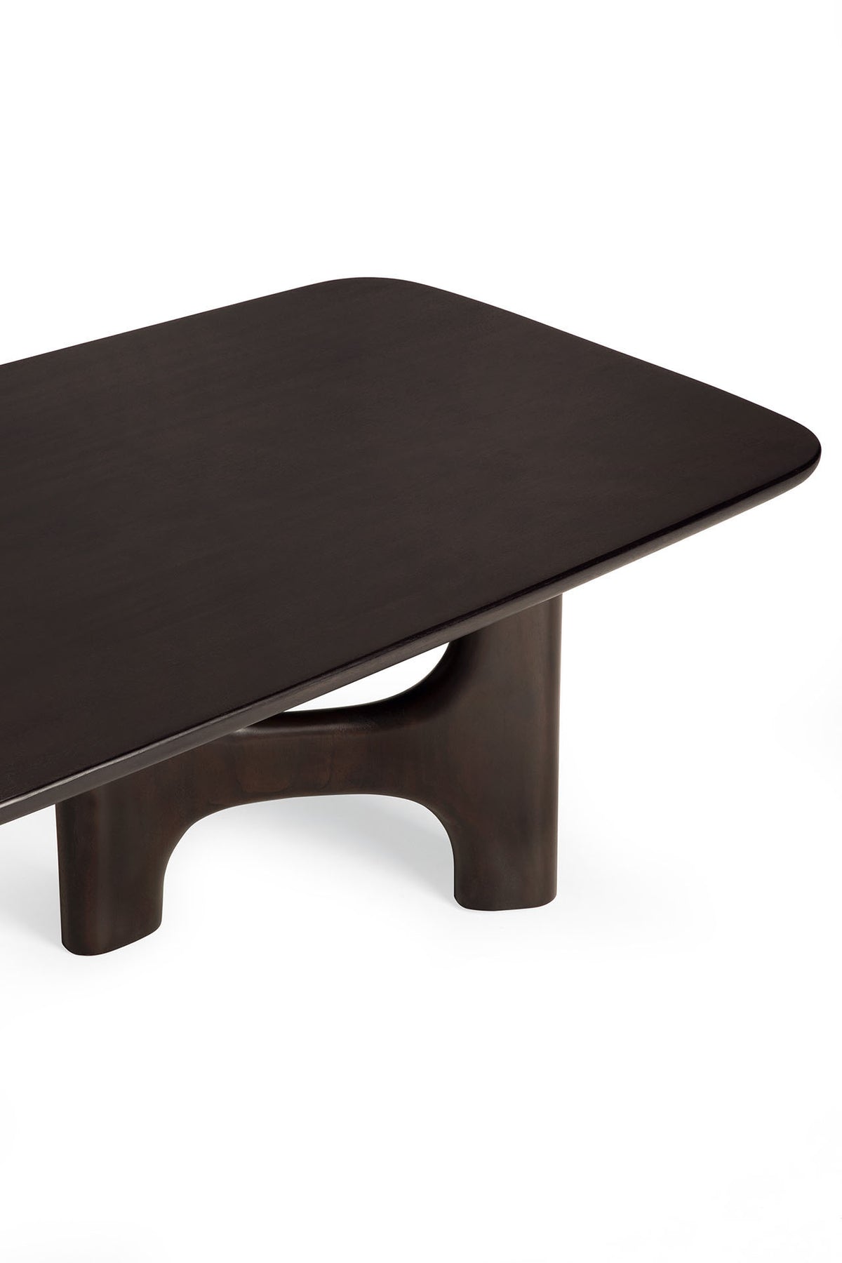 Ethnicraft Flow Coffee Table in Mahogany Rose Brown, a dark brown solid wood table featuring rounded corners and a sculptural, arched base.