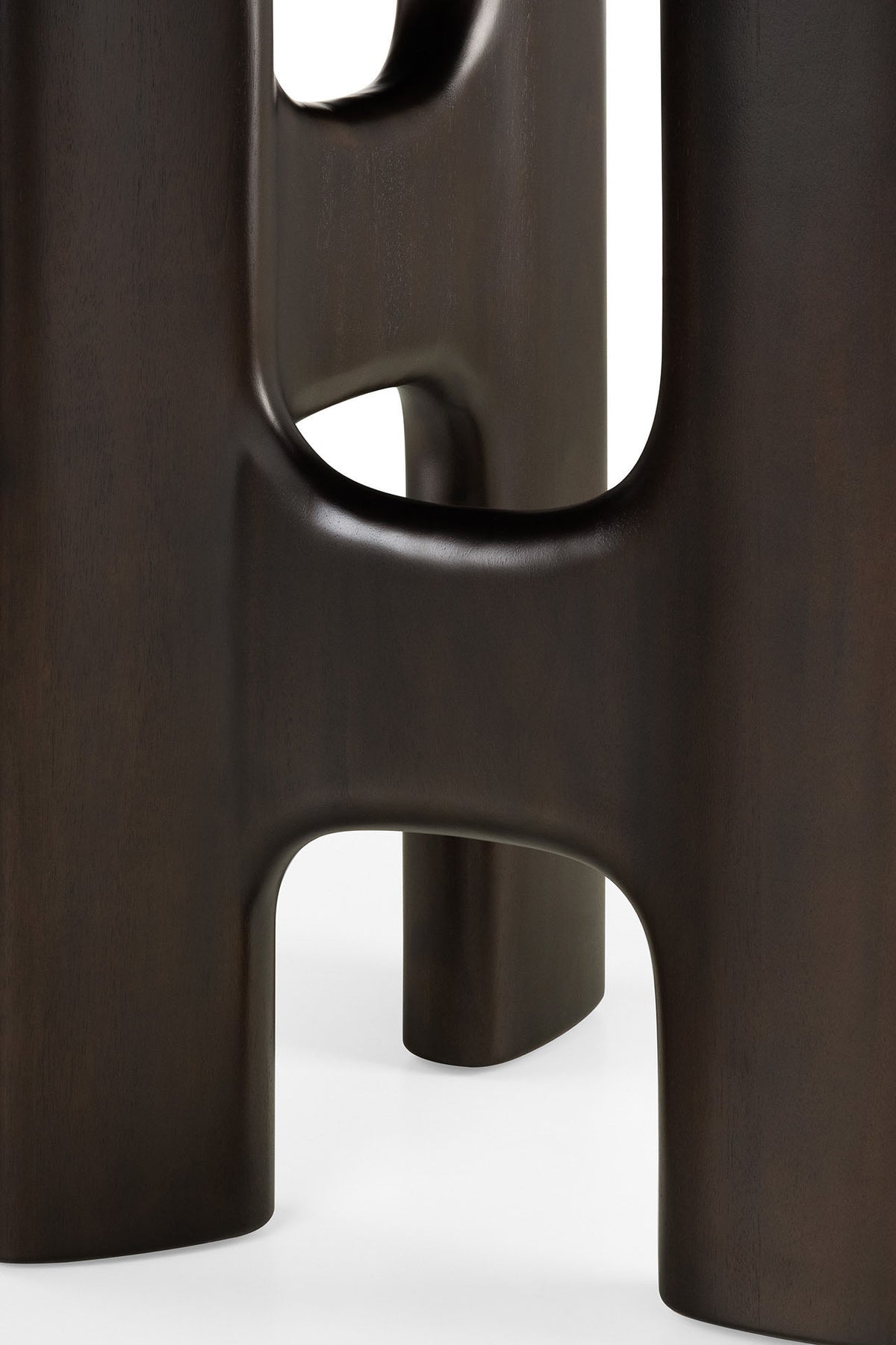 Ethnicraft Flow Dining Table | Mahogany Rose Brown featuring a dark brown solid wood base with sculptural, open cutouts.