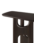 A dark brown mahogany rose brown Ethnicraft Flow Console table with a smooth tabletop and a pedestal base featuring rounded cutouts.