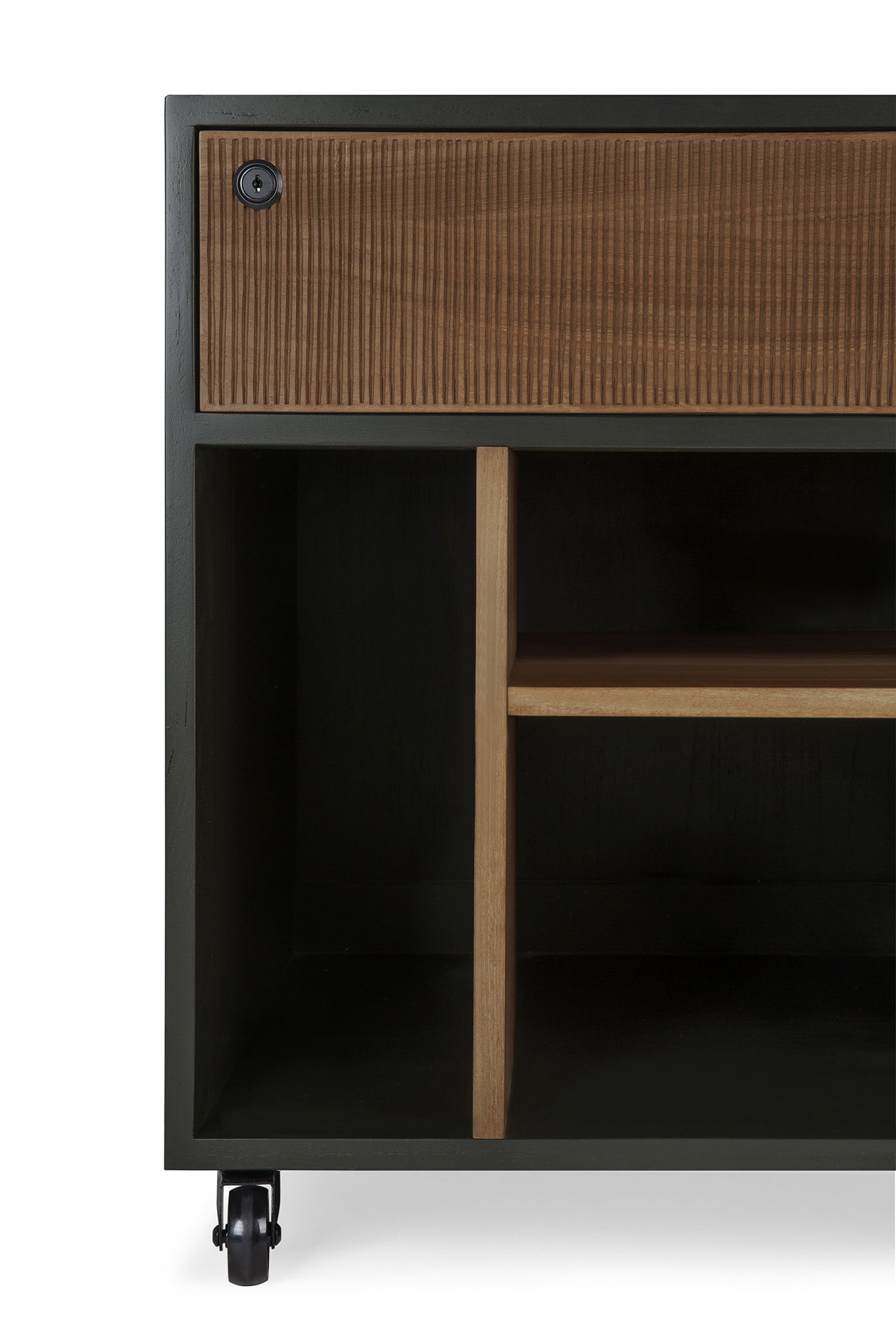 Close-up of the Ethnicraft Oscar Drawer Unit, featuring a textured solid teak wood drawer, open shelves, and caster wheels. The modern design combines contrasting black and natural wood tones, making it an ideal choice for stylish office storage.