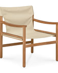 The Ethnicraft Safari Lounge Chair features a minimalist design with a light wood frame and beige fabric seat and backrest, drawing inspiration from the iconic Safari lounge chair and showcasing the refined aesthetics typical of Ethnicraft furniture.