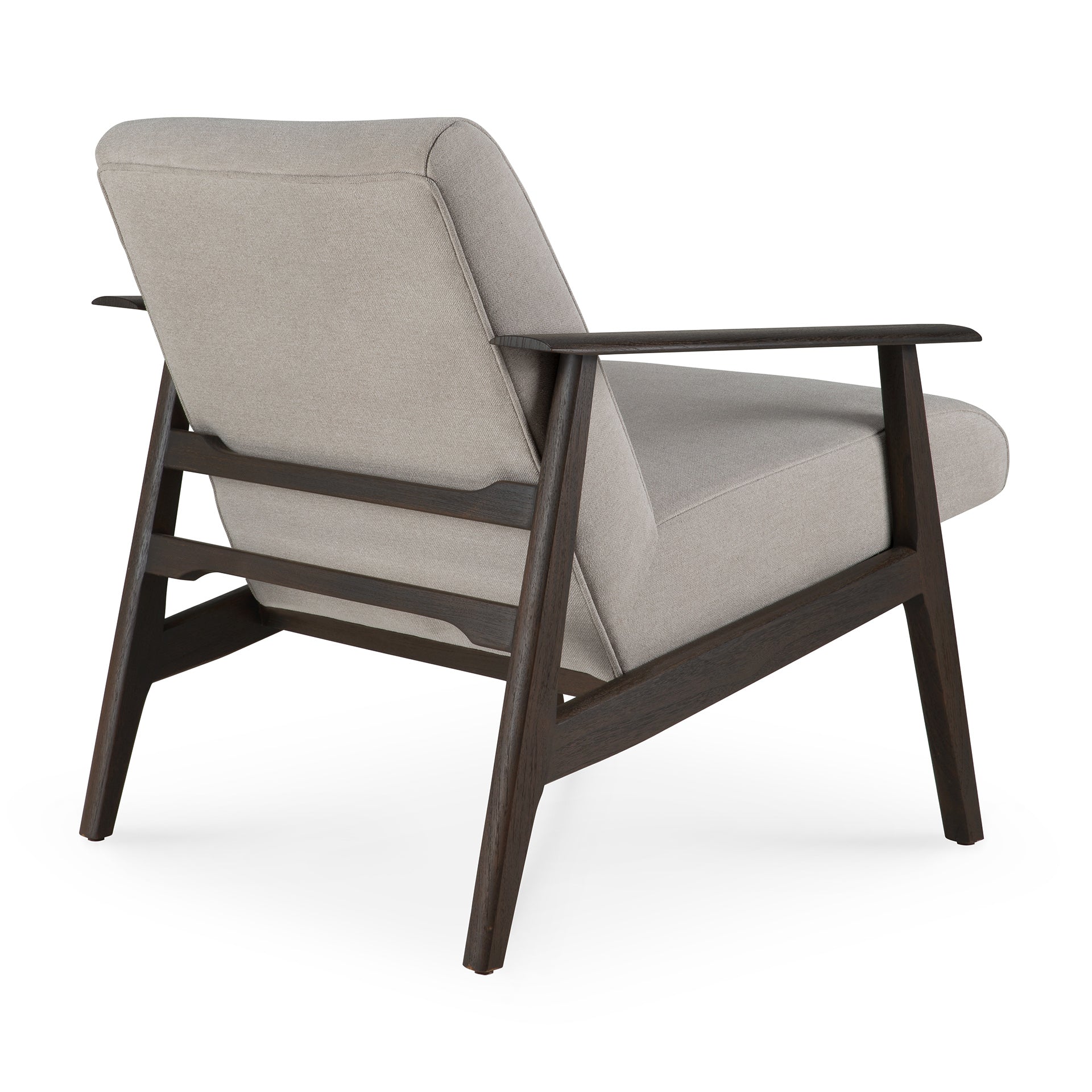 The Aspekt Lounge Chair by Ethnicraft features light gray upholstery, a dark brown teak frame, angled legs, and wide flat armrests for a stylish mid-century design, shown here from the back.