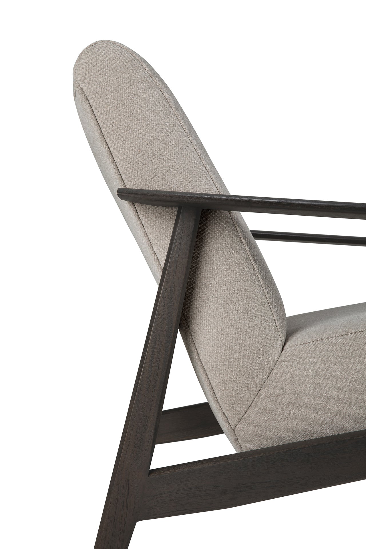 Side view of the Ethnicraft Aspekt Lounge Chair - Dark Brown Teak, featuring light beige upholstery and a dark teak frame with angular, minimalist lines inspired by Ethnicraft’s design.
