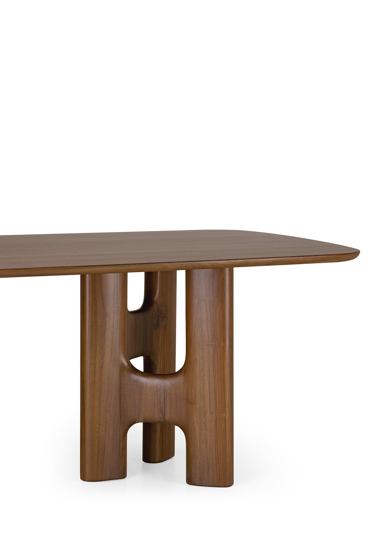 Ethnicraft Flow Dining Table | Teak Wild Brown featuring a rectangular solid wood top with rounded edges and a sculptural, hollowed-out pedestal base.