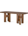 Ethnicraft Flow Dining Table | Teak Wild Brown, a solid wood dining table with a rectangular top set upon two sculptural, cutout pedestal bases.