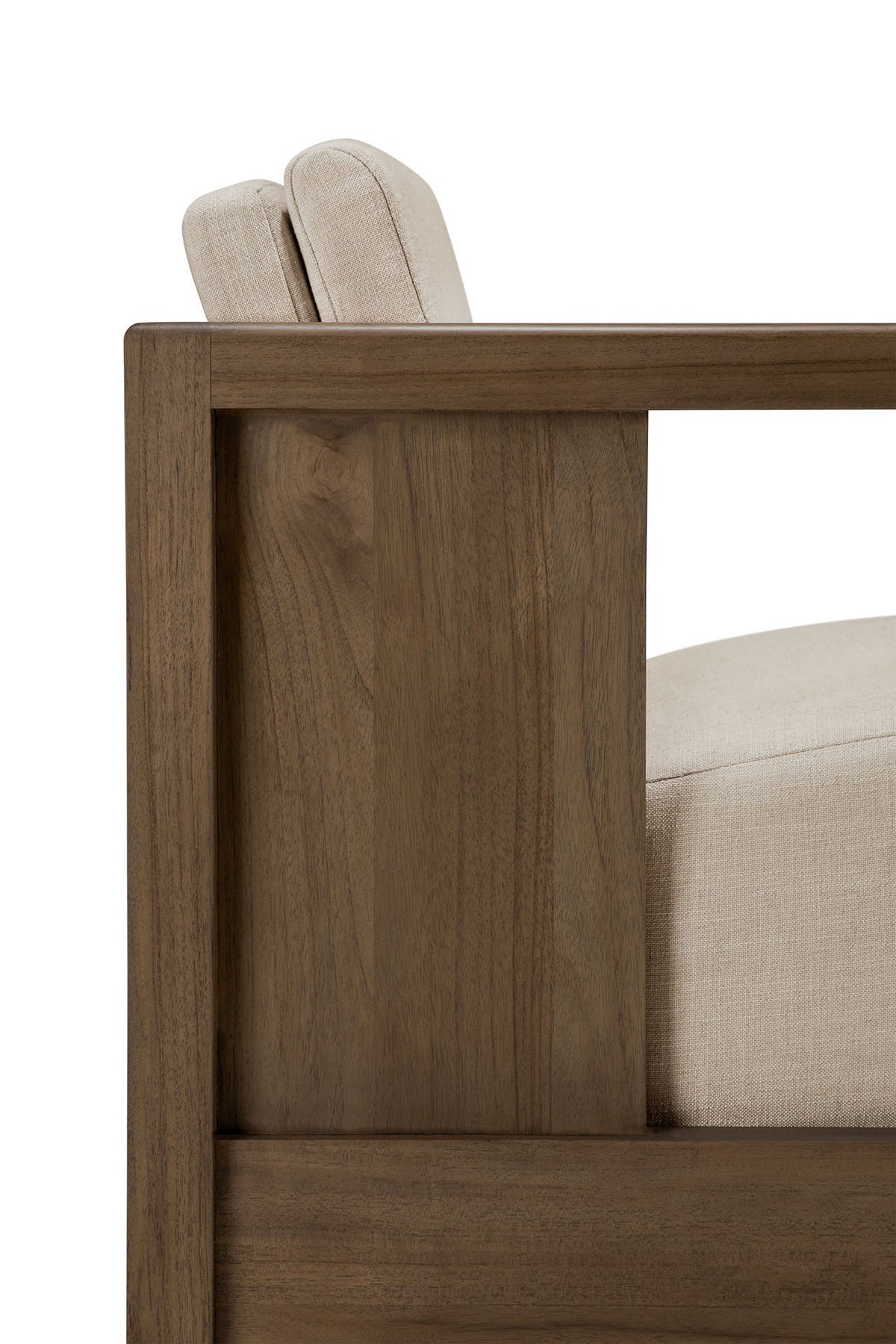 Side view of the Ethnicraft Roan Lounge Chair | Flax, featuring a modern solid teak frame with rectangular armrests and light beige upholstered cushions, highlighting its clean lines and minimalist design.
