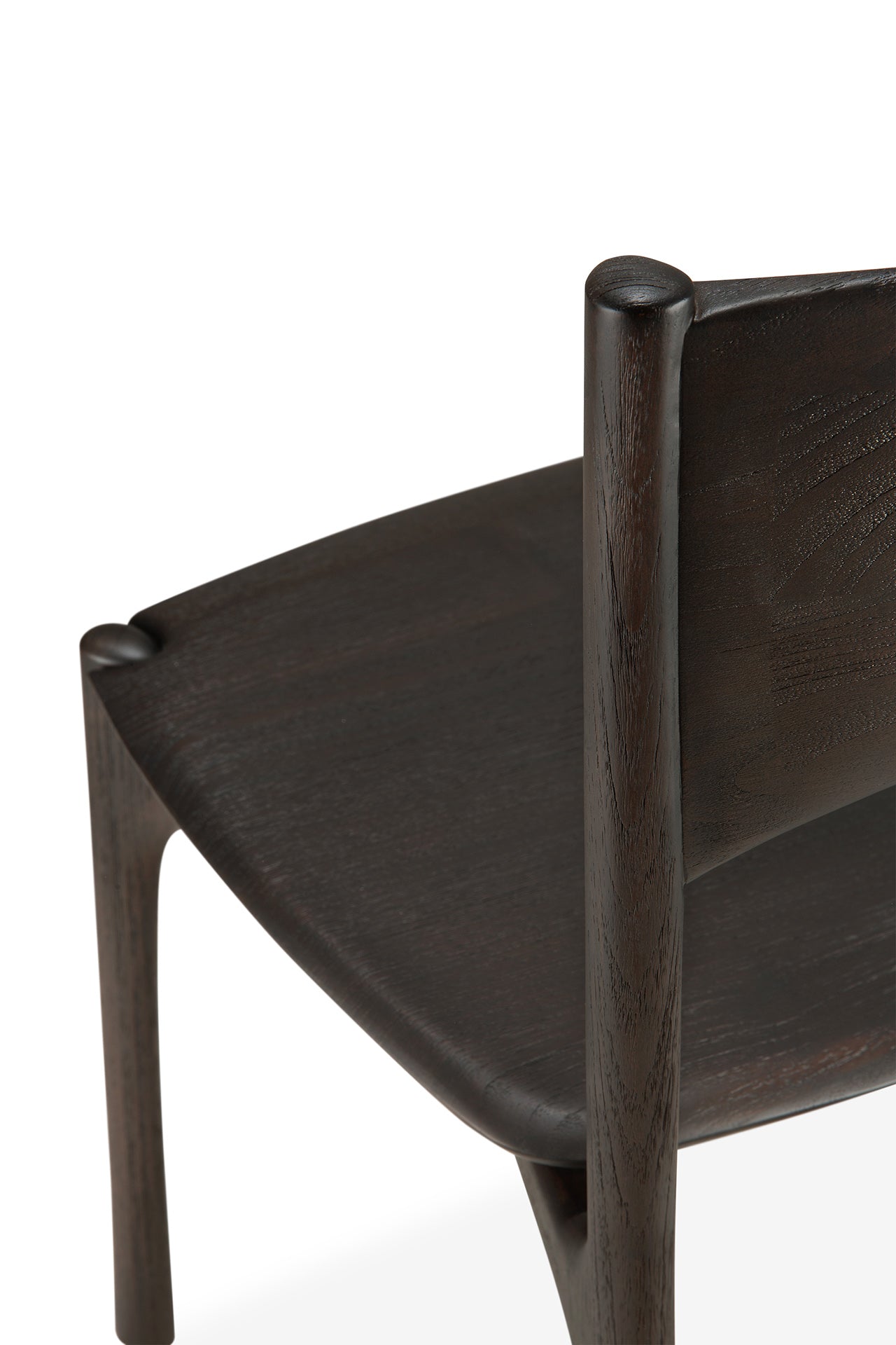 Close-up view of the Ethnicraft PI Dining Chair - Teak Dark Brown, showing its solid teak construction, smooth rounded edges, minimalist design, and highlighted wood grain craftsmanship.