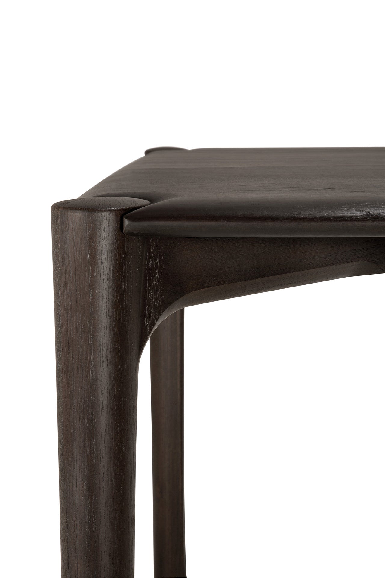 Close-up of the Ethnicraft PI Dining Table - Teak Dark Brown, featuring a flat, sculpted top and dark, smooth solid teak legs—showcasing the brand’s exceptional craftsmanship and clean lines.