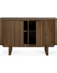 The Ethnicraft Pillar Sideboard - Teak Wild Brown features angled legs and two partially open doors, showcasing inner shelves and storage space, all set against a plain white background.