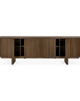 The Ethnicraft Pillar Sideboard - Teak Wild Brown features four angled doors, interior shelves, a solid teak build with a dark brown finish, and short sturdy legs for modern style.