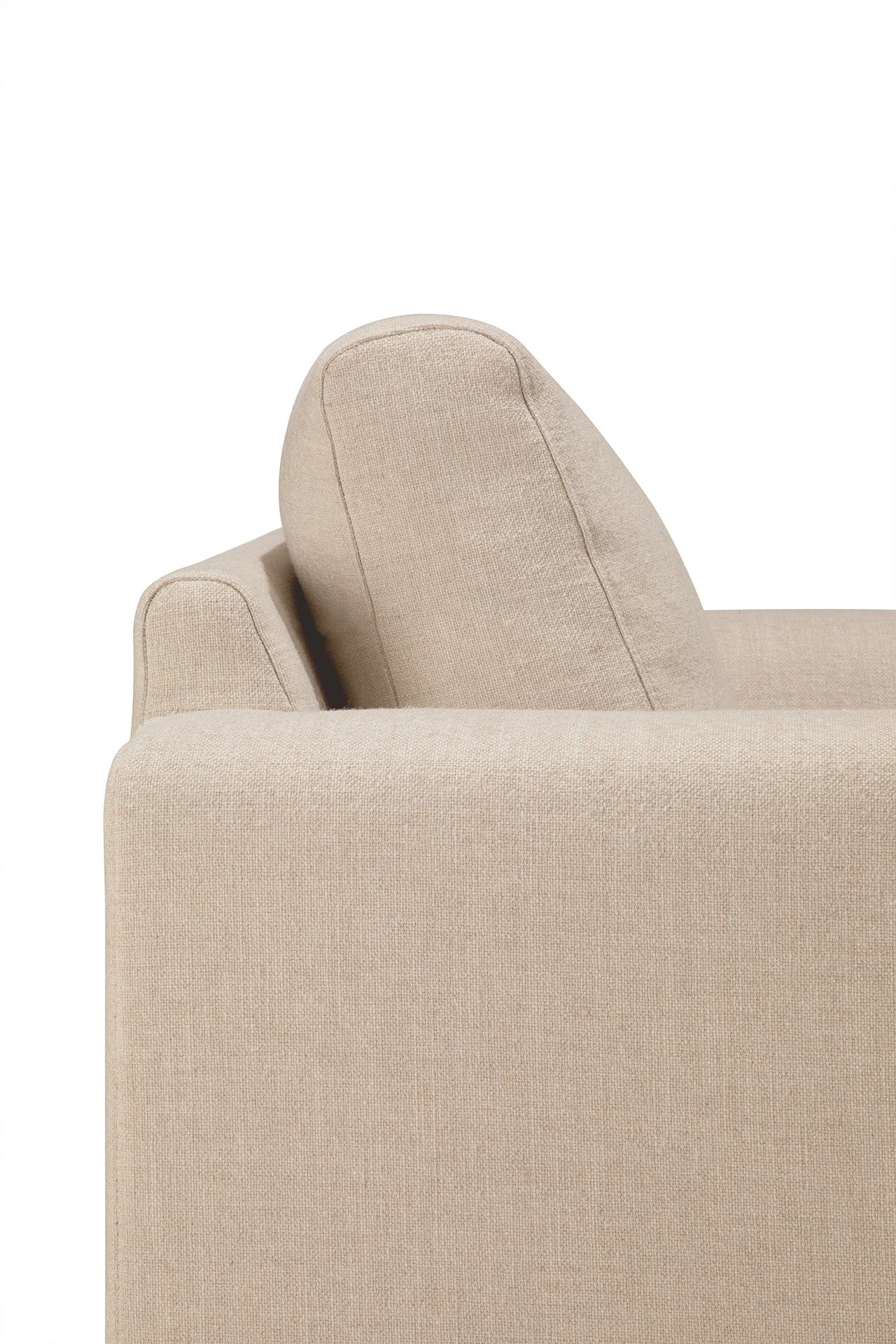 A close-up side view of the Ethnicraft Ease Lounge Chair shows its modern beige fabric, armrest, and angled back cushion filled with high-density foam against a plain white background.
