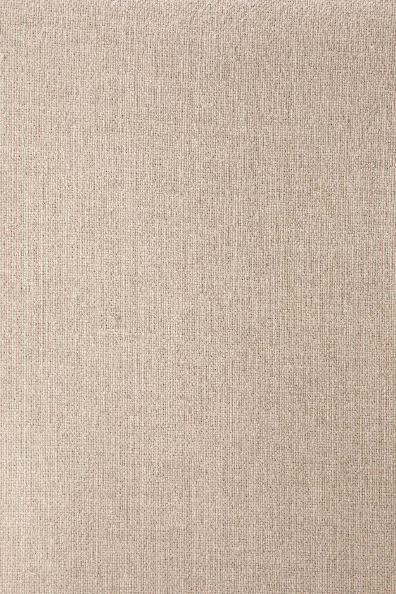 Beige textured fabric with a subtle vertical woven pattern and fine threads forms the comfortable Upholstery of the Ethnicraft Ease Lounge Chair, featuring supportive high-density foam for lasting relaxation.