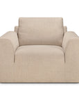 The Ethnicraft Ease Lounge Chair is a large, modern armchair upholstered in beige fabric with wide armrests and a deep, high-density foam seat, shown from the front against a plain white background.