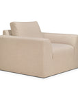The Ethnicraft Ease Lounge Chair is a modern, boxy beige armchair with clean lines, a low backrest, and high-density foam for extra comfort, upholstered in plain fabric and shown against a white background.
