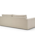 A beige, three-seater Ethnicraft Ease sofa viewed from the back, upholstered in Leche fabric.