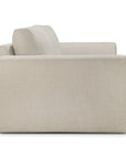 Side view of an Ethnicraft Ease sofa in light beige upholstery with square arms.