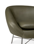 Ethnicraft Barrow Lounge Chair - Green Leather in olive green with a rounded back and thin metal legs.