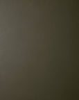 Close-up view of the olive green leather upholstery texture on a Barrow Lounge Chair - Green Leather.