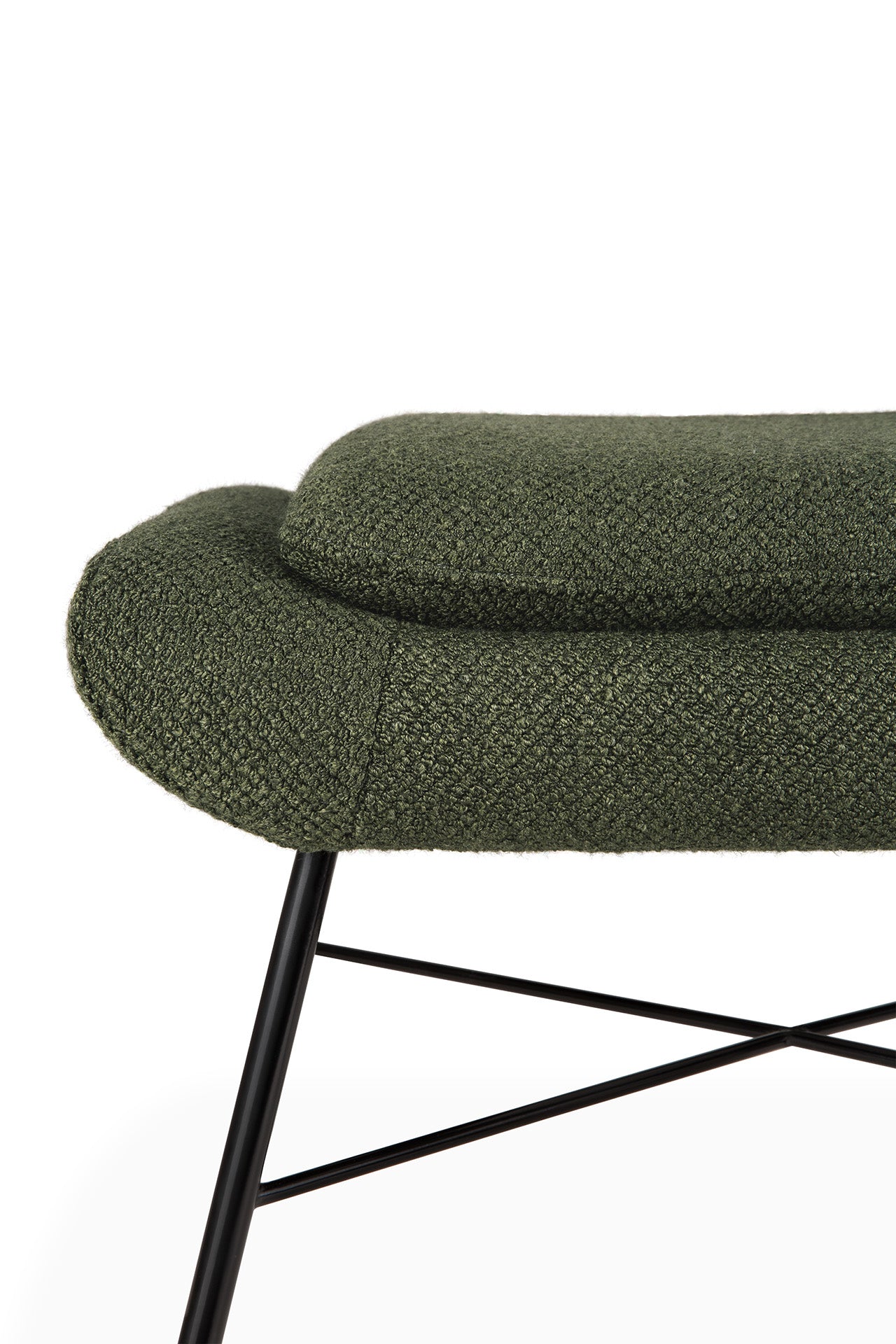 Close-up of the Ethnicraft Barrow Footstool in pine green, featuring textured upholstery, rounded edges, and slender black metal legs with crisscross supports, inspired by vintage design and set against a white background.
