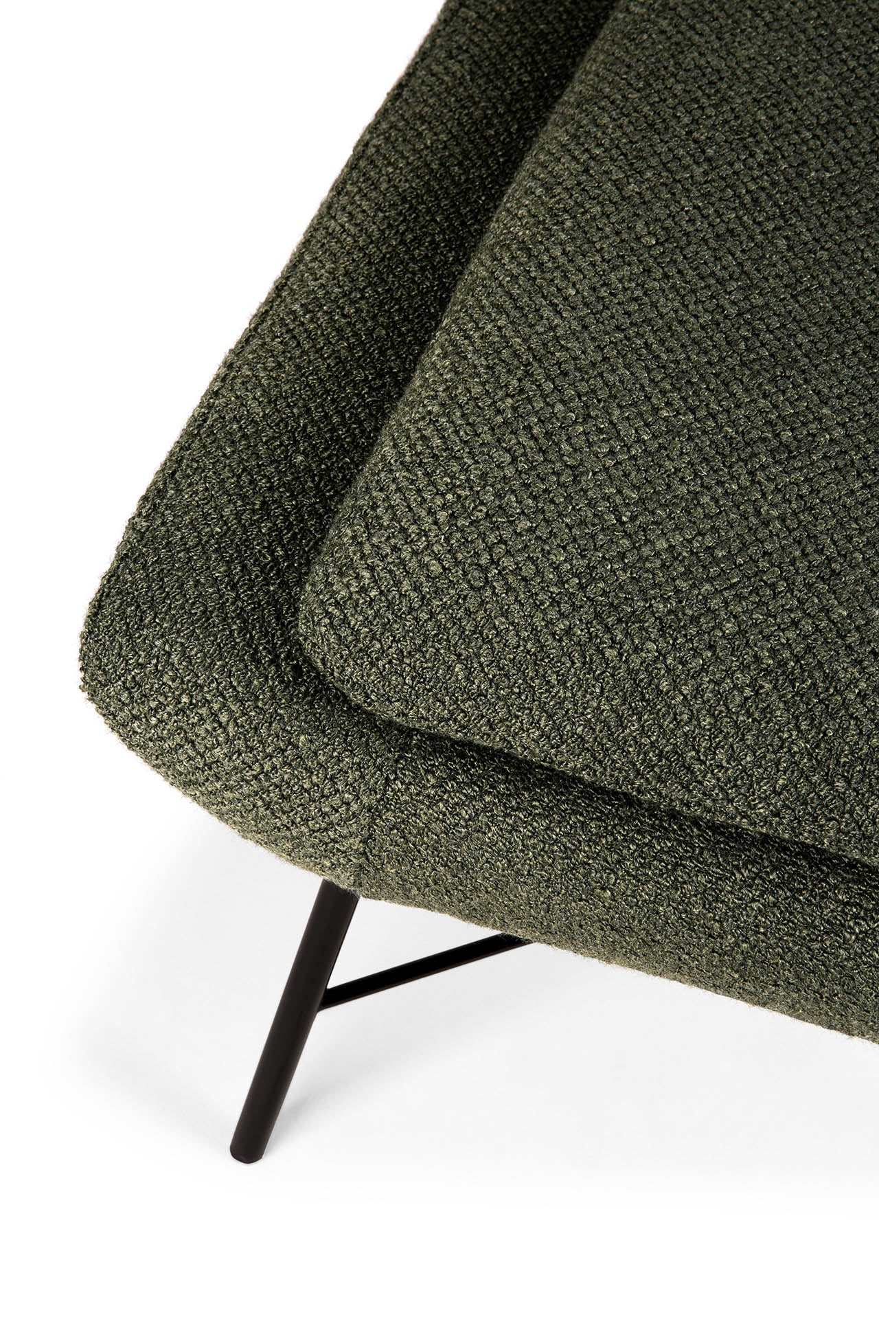 Close-up of the Ethnicraft Barrow Footstool in pine green, featuring a textured upholstered cushion and black metal legs—an elegant, vintage-inspired accent piece.
