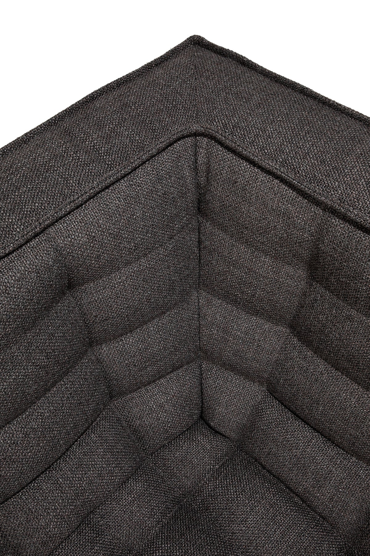 Close-up of the corner of the Ethnicraft N701 2-Seater Sofa in Dark Grey, featuring visible stitching and a textured fabric surface that accentuates its refined European design.