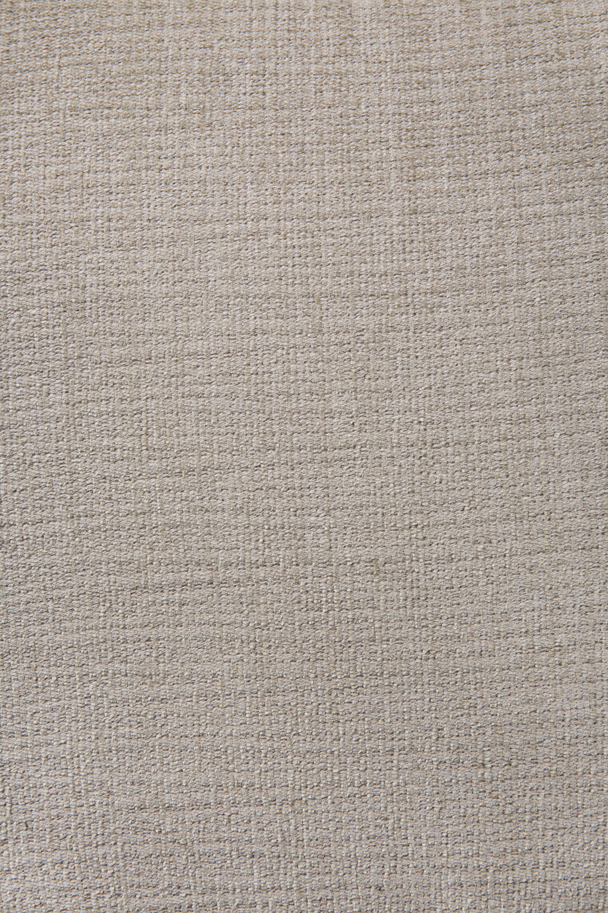 The N701 Modular Sofa in Ecru (Eco Fabric) by Ethnicraft features a simple, neutral background with subtle woven texture and a grid-like pattern, crafted from recycled cotton upholstery.