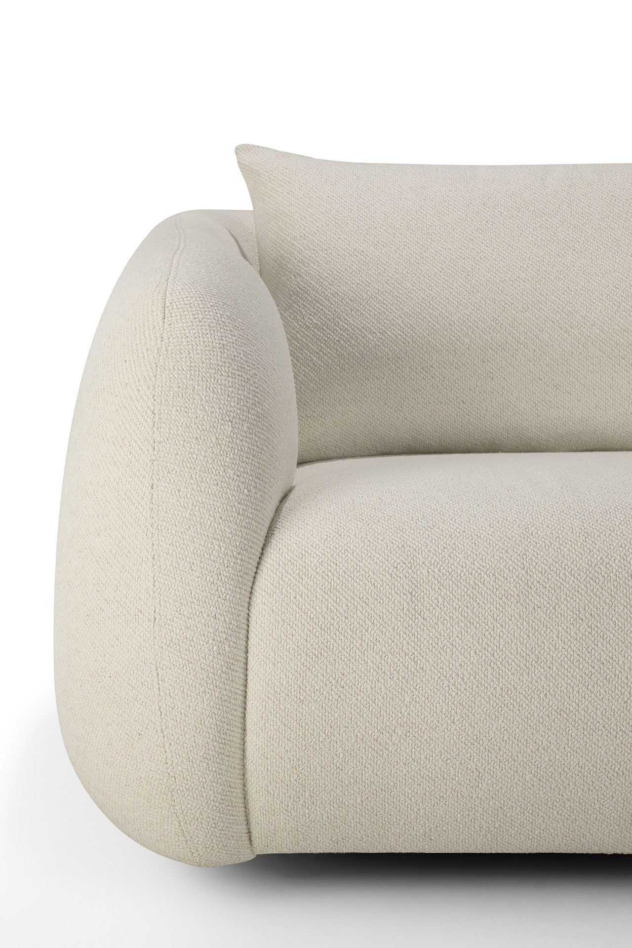 Close-up of the Ethnicraft Figur Sofa | 2 seater, showcasing its modern curved design in textured beige fabric with a coordinating rectangular cushion, set against a white background—ideal for contemporary interiors.