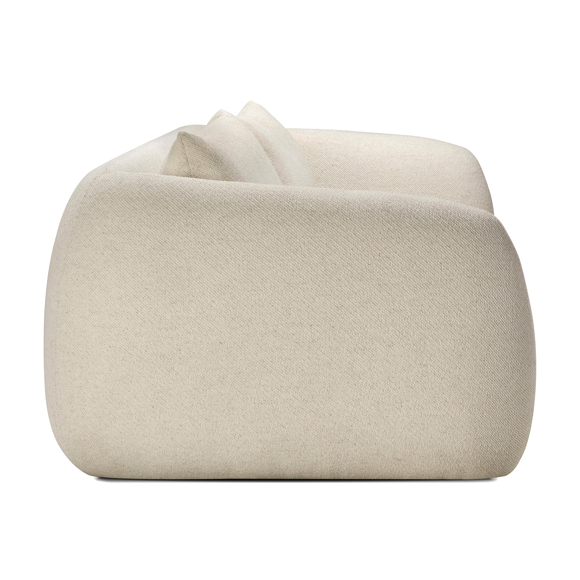Side view of the Ethnicraft Figur Sofa, featuring smooth, rounded edges and light beige upholstery, inspired by contemporary living ideals, set against a white background.