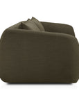 A side view of the Ethnicraft Figur Sofa | 3 Seater in dark green, featuring rounded edges and a plush, modern design, displayed against a plain white background—ideal for enhancing any contemporary living space.
