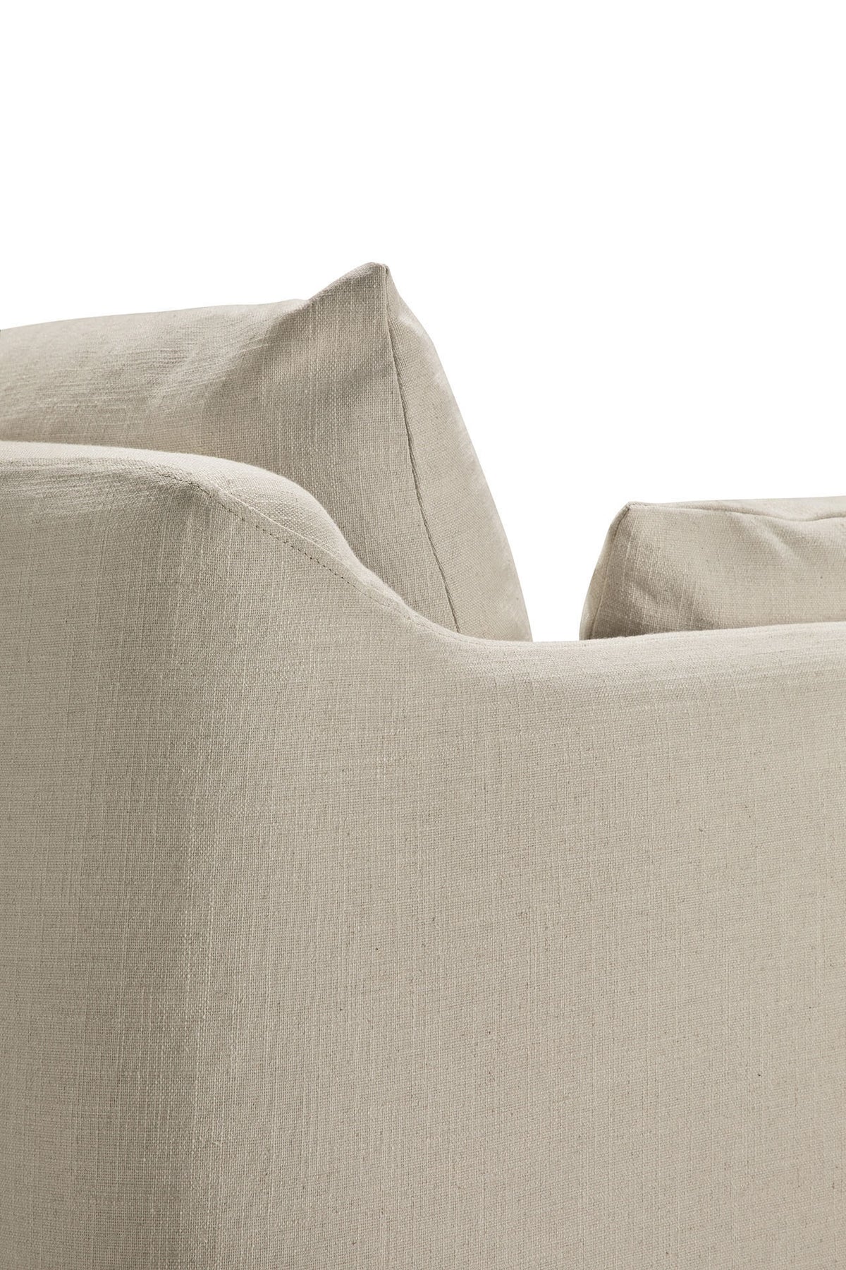 Close-up of the corner and backrest of the Weave sofa | 2 Seater Bone by Ethnicraft, showcasing its beige linen-blend upholstery with a textured surface. The image highlights the sofa’s clean lines and a slightly wrinkled cushion on its removable slipcover.